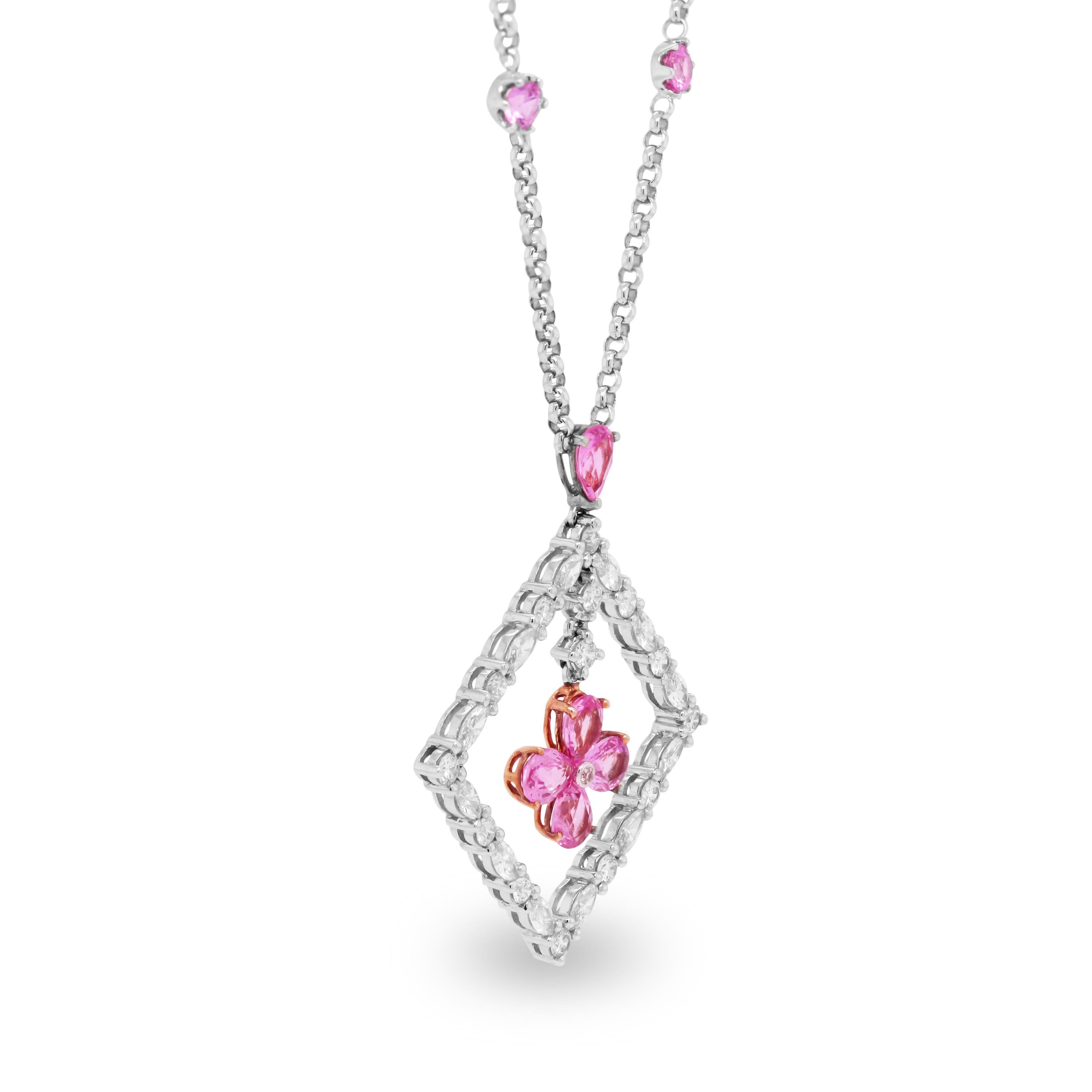 18k White Gold and Diamond Square Pendant Necklace with Pink Sapphires

This fun piece features 4 bezel set pink sapphires on the chain that lead to the pendant. The pendant has four pear shape pink sapphires in the center along with round and