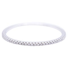 Anello nuziale in oro bianco e diamanti