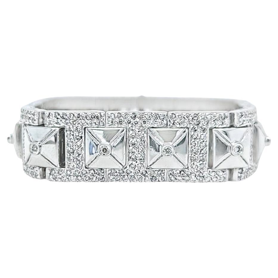 Gorgeous 18 Karat White Gold Diamond Pyramid Bracelet Measuring 14mm Wide, Featuring 645 Round Brilliant Cut Diamonds of SI Clarity and G/H Color Totaling Approximately 3.22 Carats. 7.1 Inches Long with Hidden Box Clasp and Safety. Finished Weight