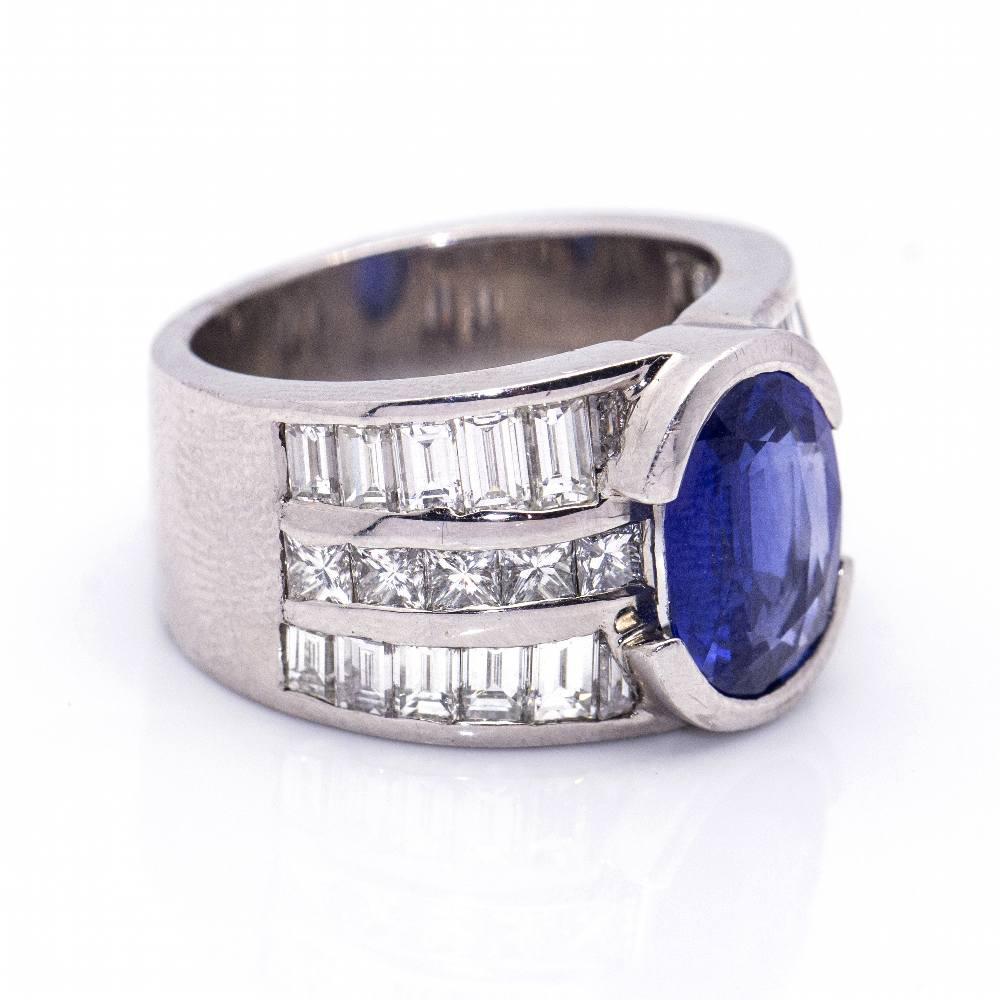 White Gold Ring with Diamonds and Sapphire for woman  Diamonds in Brilliant and Baguette cut with a total weight of 3.70 cts in G/Vs quality  1x Sapphire originating from Cashmere in Oval cut of 11x8mm and 3.00ct weight l Size 14  18kt White Gold 