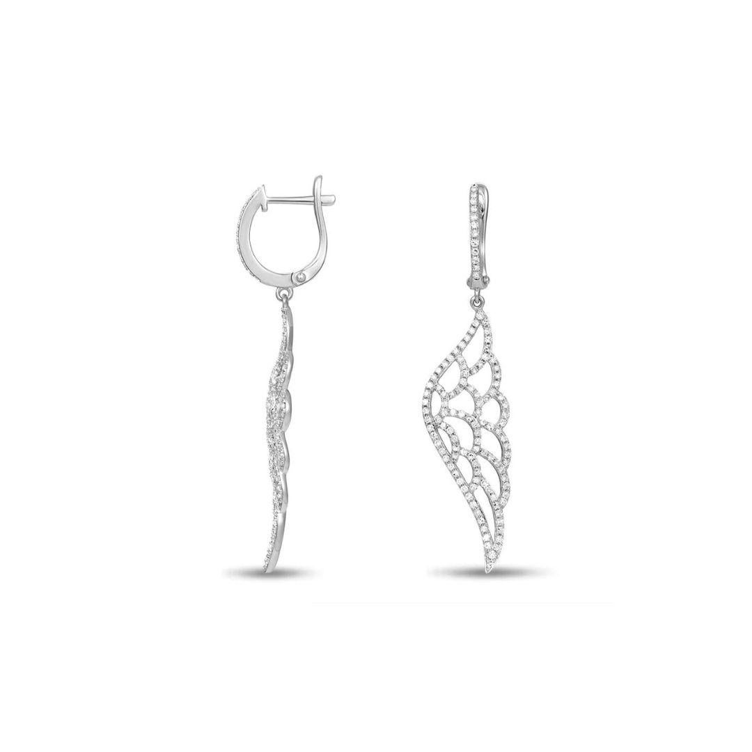 Elegant angel wing diamond drop earrings in soft 14k white gold. Perfect luxury accessory for a special night or a special event. Earrings contain 238 round white diamonds, H-I color, SI clarity, 0.70 ctw, and measure approximately 1.75 inches in