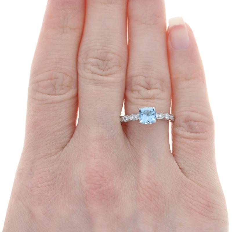 Size: 7
Sizing Fee: Down 1 size for $30 or up 2 sizes for $35

Metal Content: 14k White Gold

Stone Information
Natural Aquamarine
Treatment: Heating
Carat: .74ct
Cut: Cushion
Color: Blue
Size: 6.1mm (square)

Natural Diamonds
Carats: .33ctw
Cut: