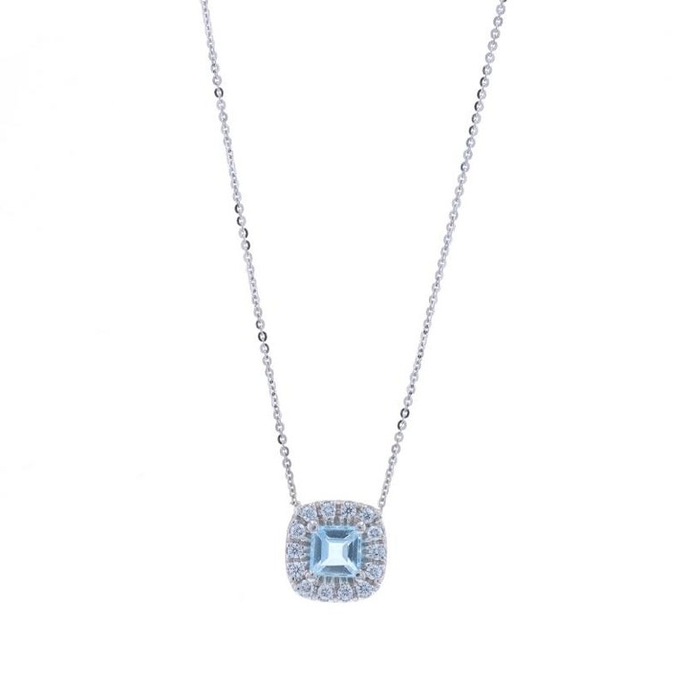 14k White Gold Genuine Ruby & .06CTW Diamond Halo-Style Pendant 14k White Gold Genuine Ruby & .06CTW Diamond Halo-Style Pendant