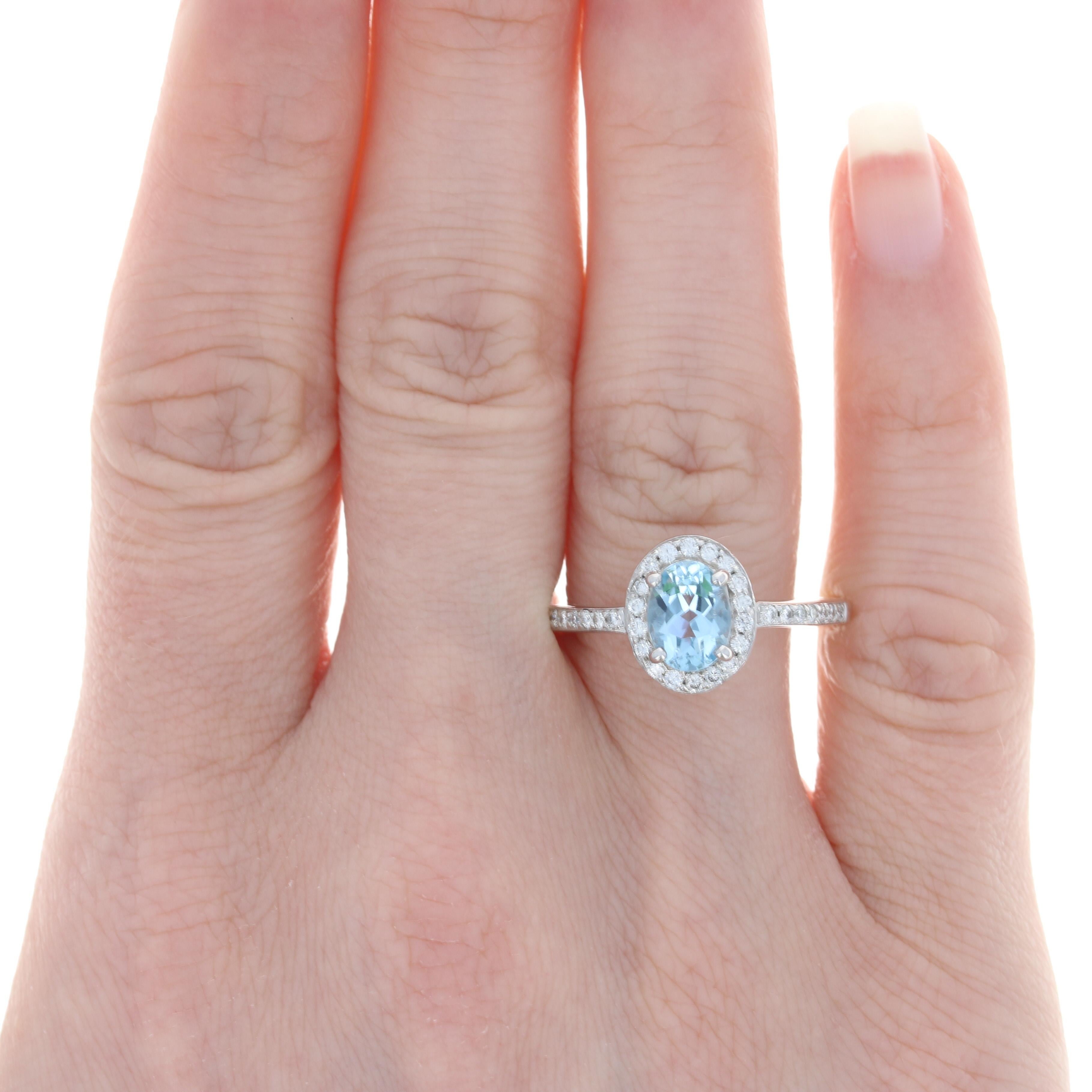 Size: 8 1/4
Sizing Fee: Can be sized down 1 size or up 2 sizes for $25

Metal Content: 14k White Gold 

Stone Information: 
Genuine Aquamarine
Treatment: Heating
Carat: 1.06ct (weighed) 
Cut: Oval
Color: Blue
Size: 7.8mm x 5.9mm

Natural