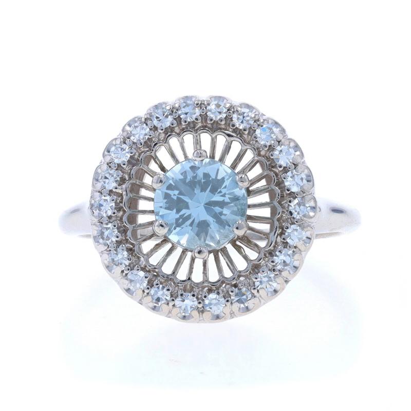 Size: 7
Sizing Fee: Up 2 sizes for $50 or Down 1 1/2 sizes for $30

Era: Vintage

Metal Content: 18k White Gold

Stone Information
Natural Aquamarine
Treatment: Heating
Carat(s): .67ct
Cut: Round
Color: Light Blue

Natural Diamonds
Carat(s):