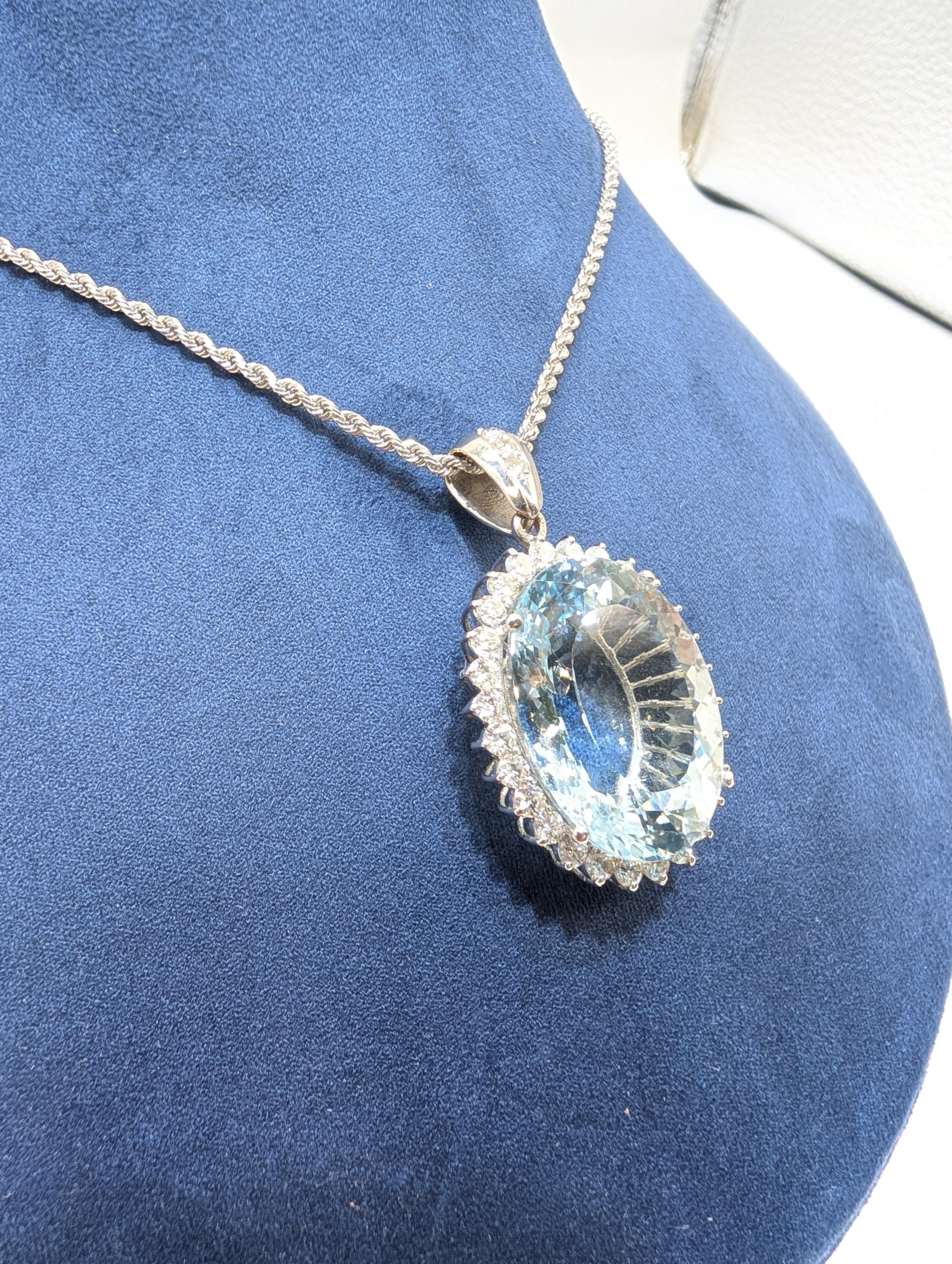 Oval Cut White Gold Aquamarine Pendant Set In Halo Setting For Sale