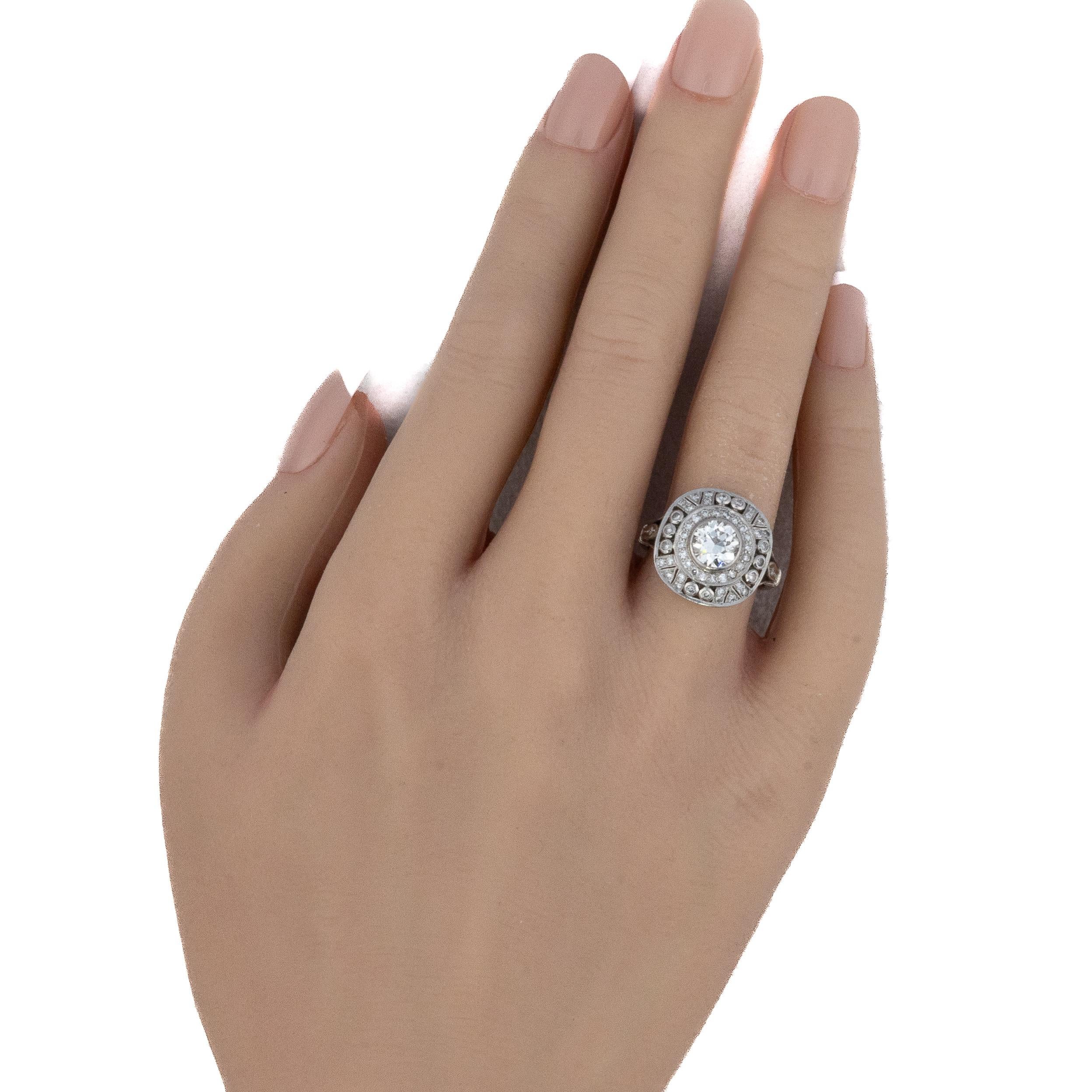 White Gold Art Deco Circular Diamond Halo Ring

Description: This 18K white gold ring features a beautifully detailed circular halo design centered around a bright round diamond, framed by concentric rows of smaller diamonds and intricate milgrain