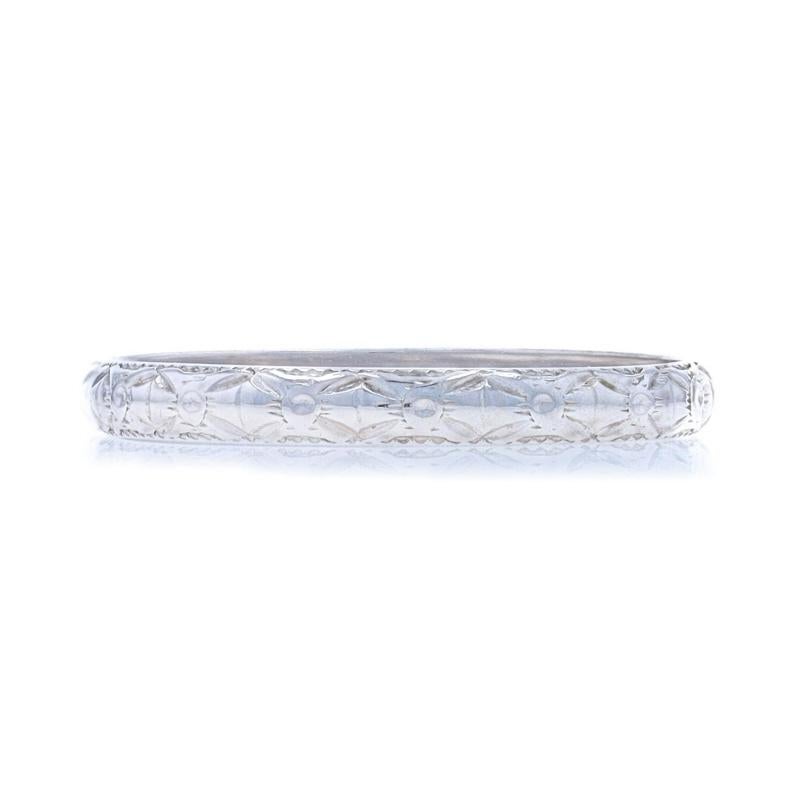 Size: 6

Era: Art Deco
Date: 1920s - 1930s

Metal Content: 18k White Gold

Style: Wedding Band without Stones
Theme: Floral Bow
Features: Etched floral bow design spanning the band's entire perimeter

Measurements

Face Height (north to south):