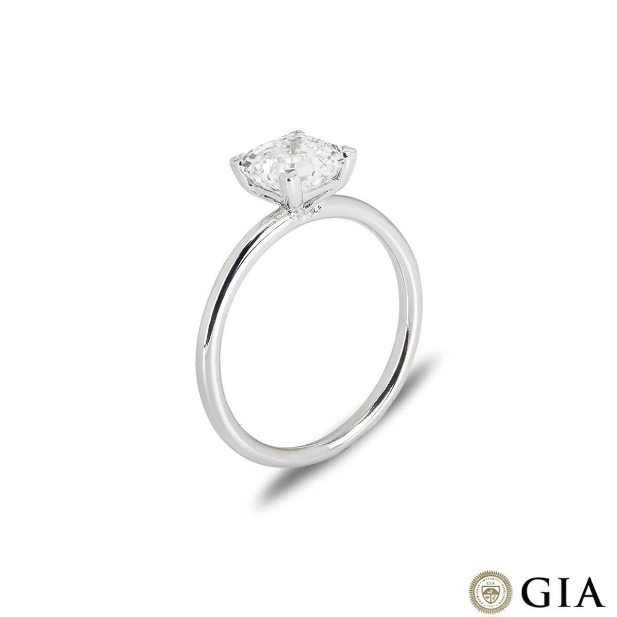 A striking 18k white gold diamond engagement ring. The solitaire features an Asscher cut diamond in a four claw mount weighing 1.50ct, I colour and SI1 clarity. The ring measures 1.70mm wide, has a gross weight of 2.44 grams and is currently a UK