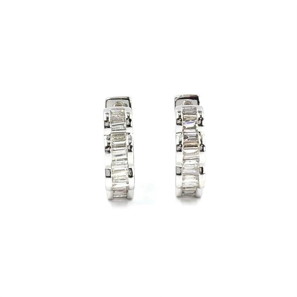 Timeless 14 karat white gold baguette diamond huggie style earrings with a unique scalloped design featuring approximately 1.92 carats of diamonds. Diamond quality is approximately H color,  SI1 clarity. Cut out hearts, moons and stars adorn the