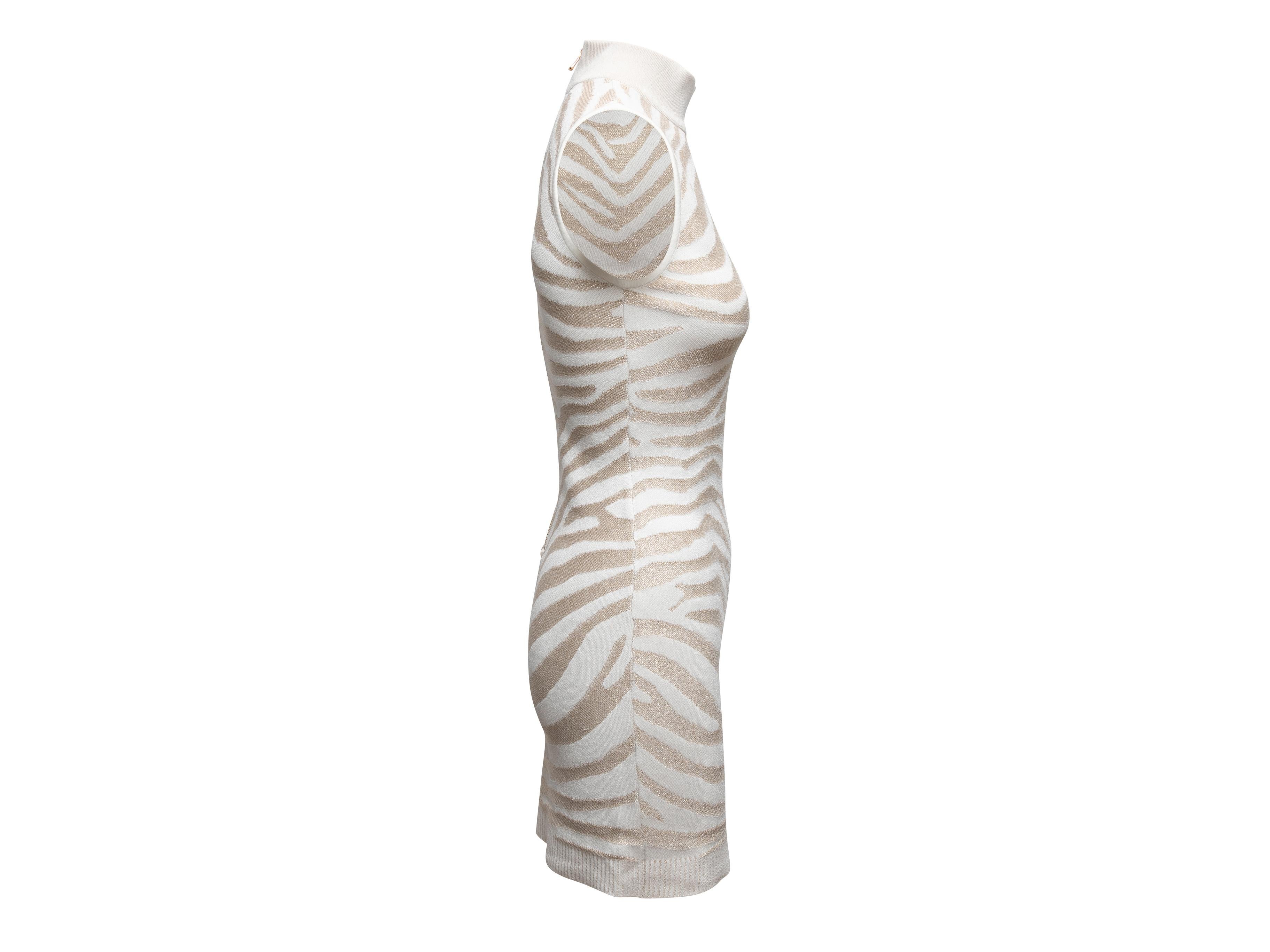 White and gold zebra patterned sleeveless knit dress by Balmain. Mock neck. Zip closure at center back. 30