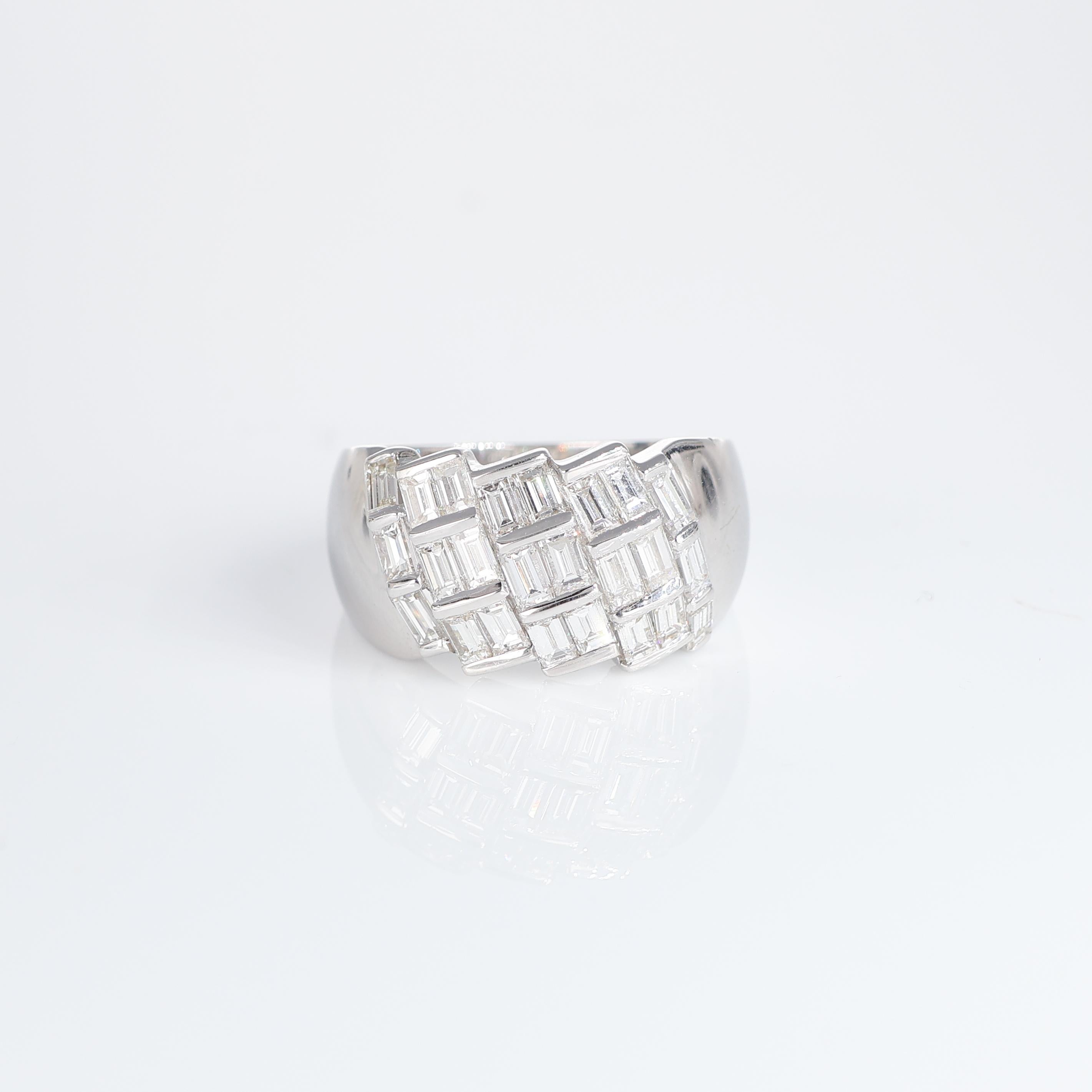 IMPORTANT NOTE:
✔ No additional costs will be added to this order.
✔ Shipping and customs duties are fully covered by us.
--------------------
Description: This striking 18kt White gold band ring, features a captivating arrangement of baguette-cut