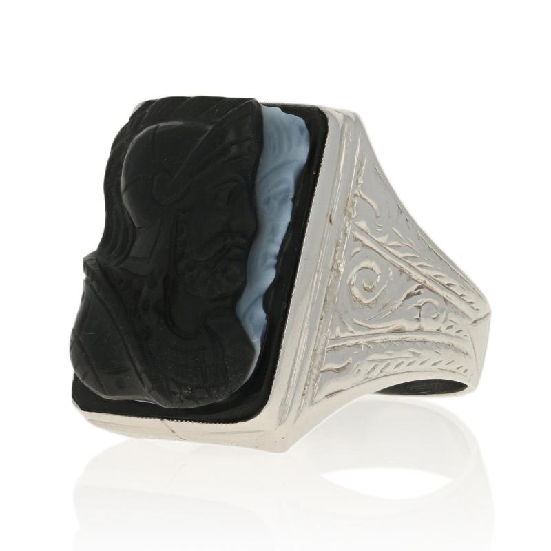 Size: 10 1/4
Sizing Fee: Up or Down 1 size for $50

Art Deco Style

Metal Content: 14k White Gold

Stone Information: 
Genuine Carved Banded Agate Cameo
Colors: Black & White

Face Height (north to south): 7/8