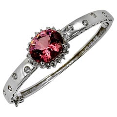 Vintage White Gold Bangle Bracelet with 4.27ct Oval Pink Tourmaline and Diamond Halo