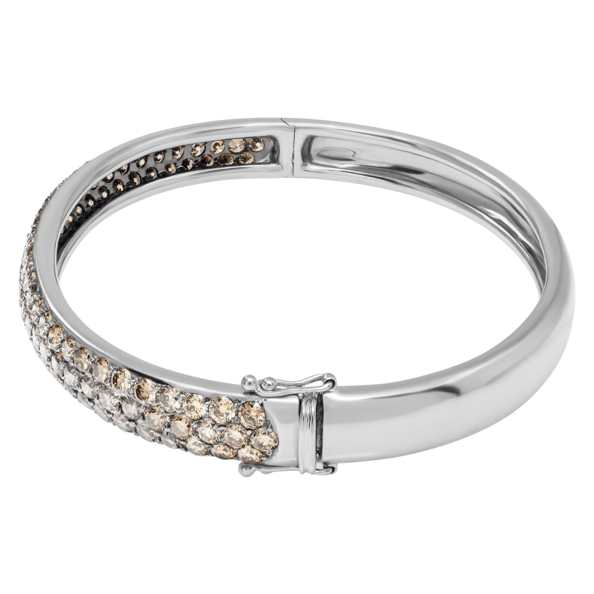 Bangle with brown diamonds in 18k white gold with approximately 4 carats in brown  color diamonds. Fits up to a 6- 7 inch wrist.
