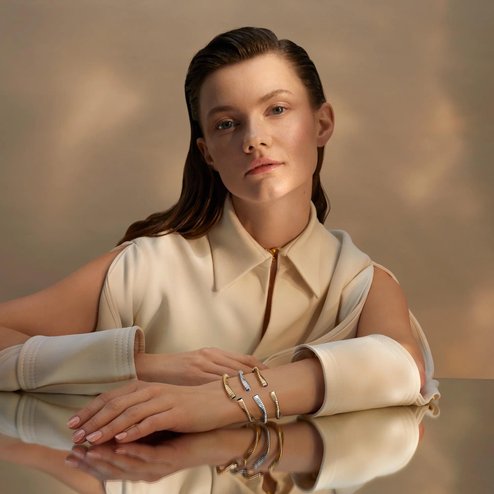 The Wave bracelet is a symbol of refined elegance. 
Carefully crafted in white gold and embellished with mesmerizing blue mosaic details, this bracelet exudes charm. 
Whether stacked with other pieces or worn alone, this bracelet will effortlessly