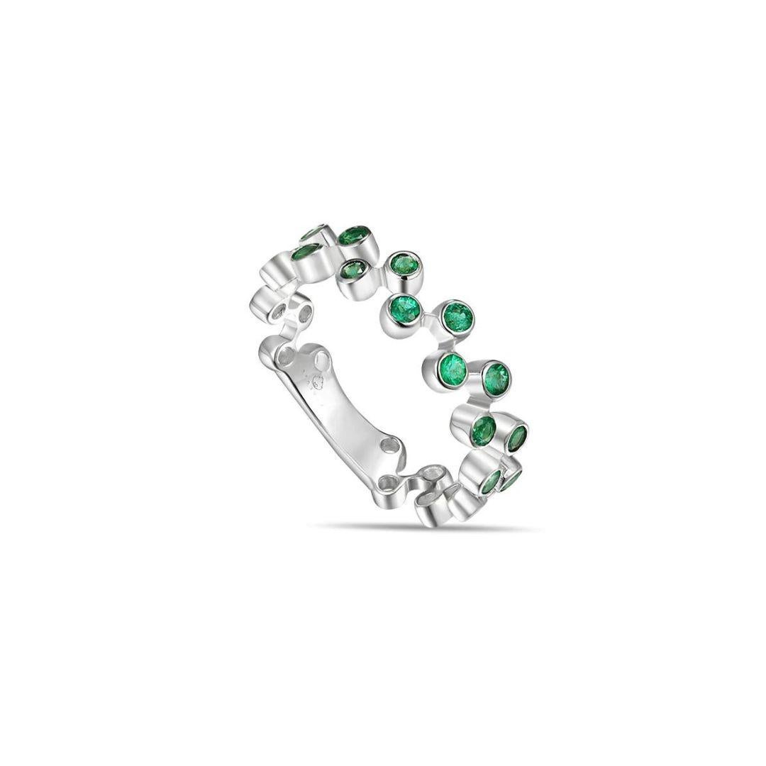 White gold emerald fashion band with open space design and intricate bezel work. Use this ring as a stackable band to combine or complement other rings, as a one of a kind wedding band, anniversary gift, birthday gift for May or any other special