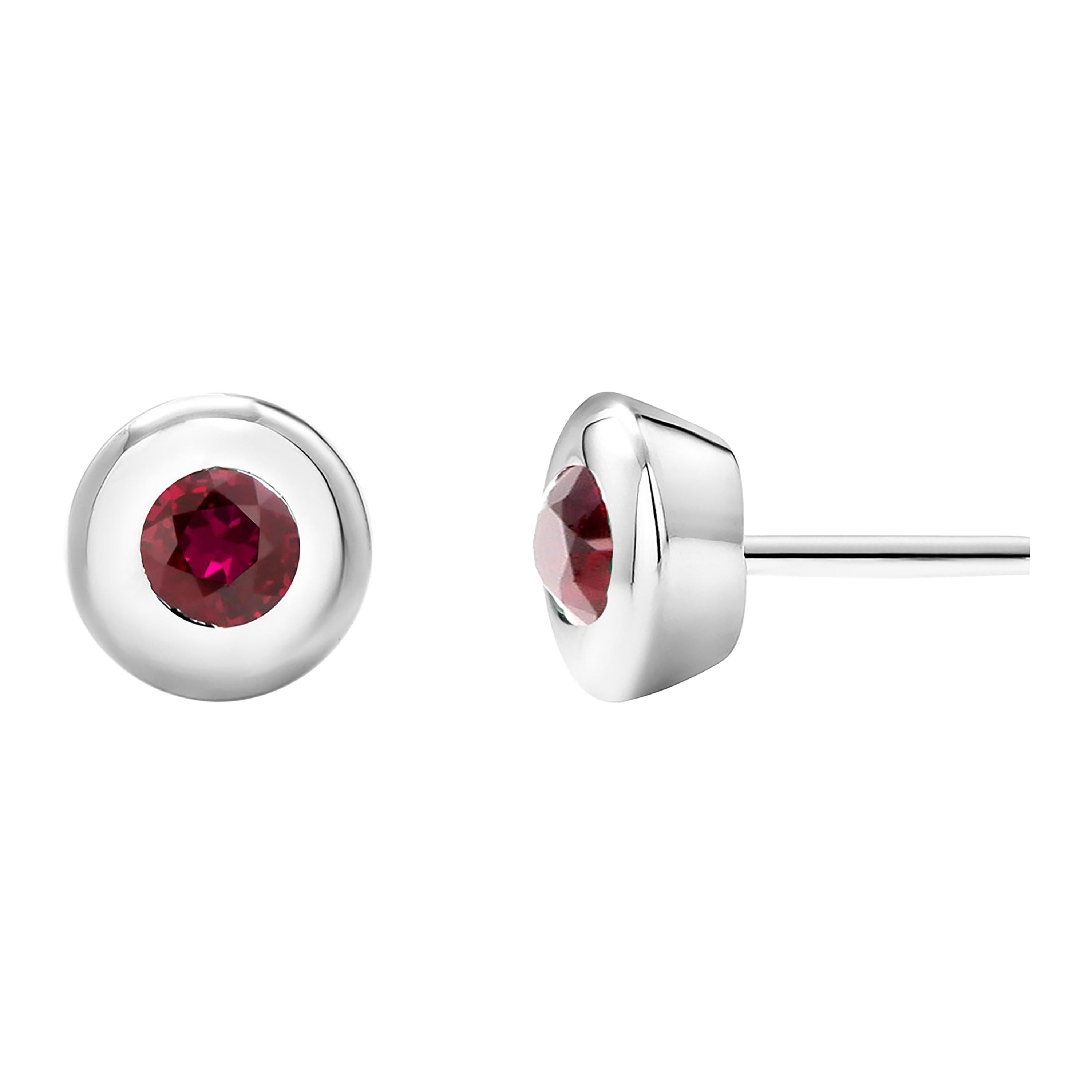 White Gold Bezel Set Ruby Stud Earrings Weighing 0.30 Carat