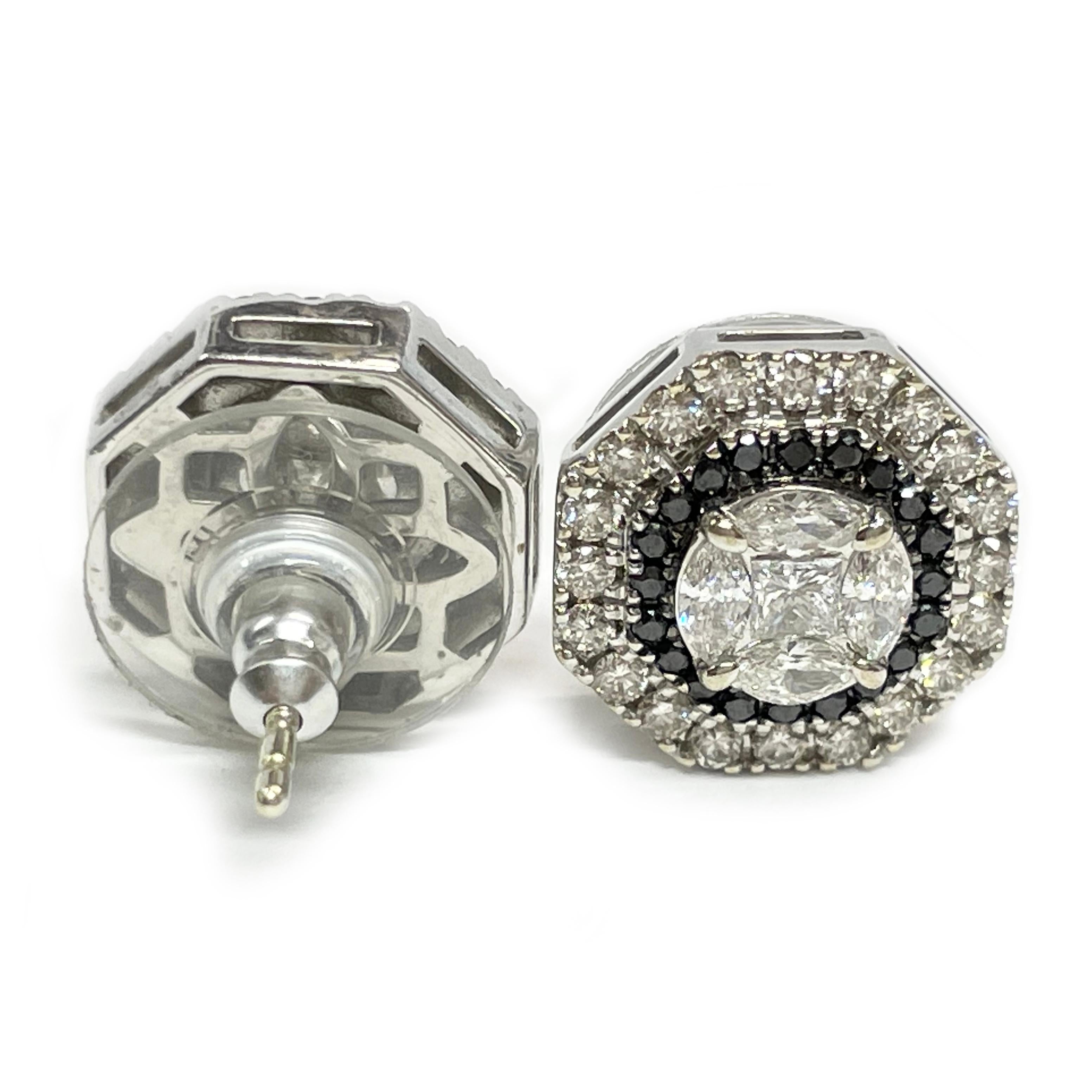 14 Karat white gold black and white diamond stud earrings. The octagon shaped earrings feature a combined carat total weight of 1.84ctw. There are thirty-eight 1.72mm round white diamonds, forty 1.56mm round black diamonds, eight 3 x 1.5mm marquise