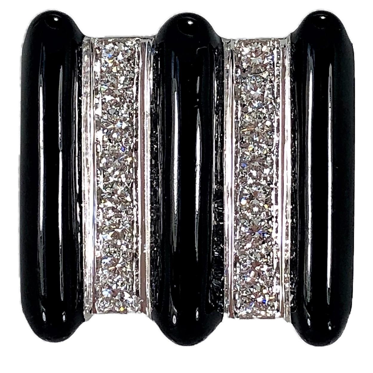 Made of 18K white gold with black enamel accents and set
with 16 round brilliant cut diamonds weighing an approximate
total of 1.00CT of overall G Color and VS1 Clarity. This large
scale, vertical design ring measures 1 inch by 1 inch across the