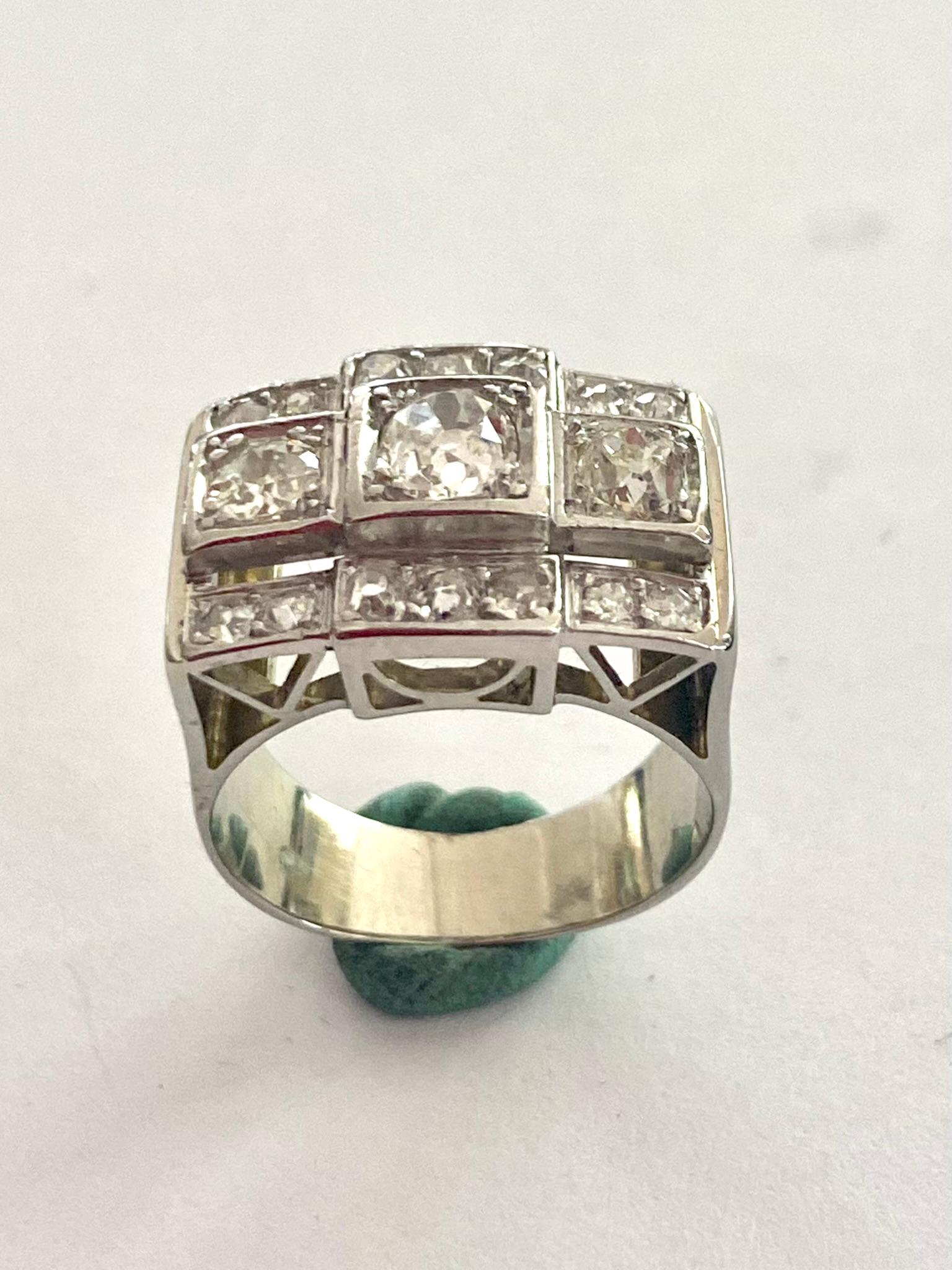 A 14K. (585/-) white gold ring, rectangular model with 17 old European cut diamonds.
Diamond weight: 1.80 ct quality: various Si/P3 color: F-L
Weight: 10.58 grams
size: 18x13x6 mm
Ring size: 17 (53.5) USA: 6.5 UK: N
Made in the Netherlands ca 1940 -