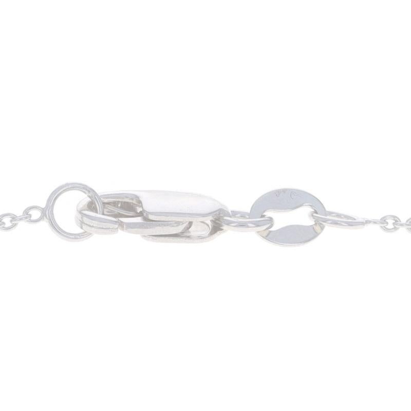 Collana incrociata in oro bianco con diamante e topazio blu da 18