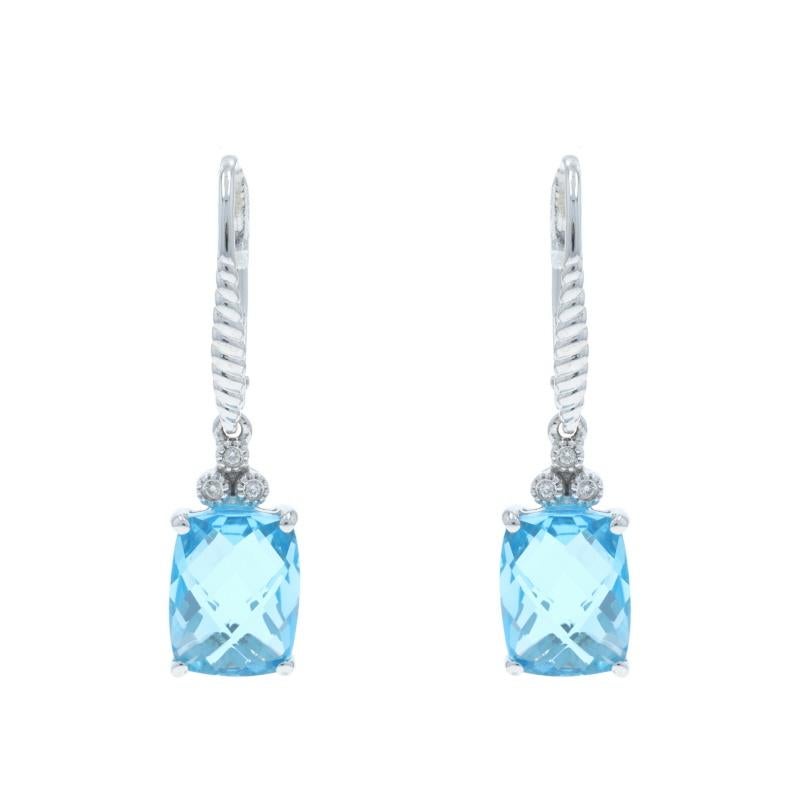 Contenu métallique : Or blanc 14k

Informations sur les pierres

Topaze bleue naturelle
Traitement : Amélioration de routine
Carat(s) : 6.80ctw
Coupe : Coussin en damier

Diamants naturels
Carat(s) : .03ctw
Coupe : Brillant rond
Couleur : H -