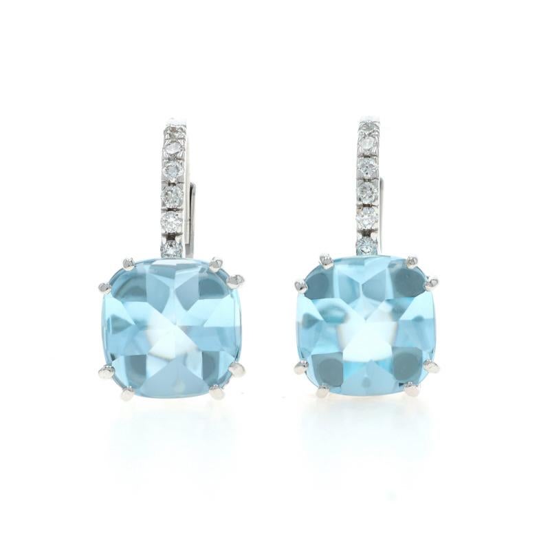 Metal Content: 18k White Gold

Stone Information

Natural Blue Topaz
Treatment: Routinely Enhanced
Carat(s): 5.00ctw
Cut: Buff Top Cushion

Natural Diamonds
Carat(s): 0.08ctw
Cut: Round Brilliant
Color: G
Clarity: VS1 - VS2

Total Carats: