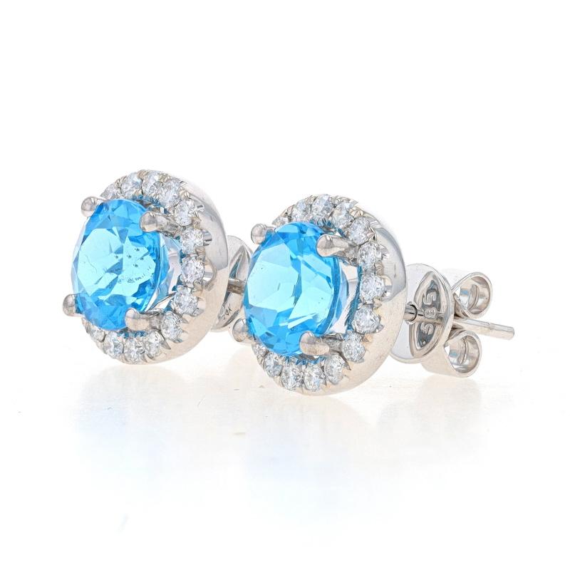 Metal Content: 14k White Gold

Stone Information
Natural Topaz
Treatment: Routinely Enhanced
Carat(s): 3.34ctw
Cut: Round
Color: Blue

Natural Diamonds
Carat(s): .50ctw
Cut: Round Brilliant
Color: G
Clarity: VS1 - VS2

Total Carats: 3.84ctw

Style: