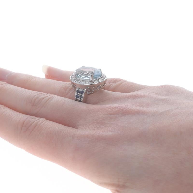 Donna Anello aureola in oro bianco con topazio blu, diamante e zaffiro - 14k Ovale 7,52ctw in vendita
