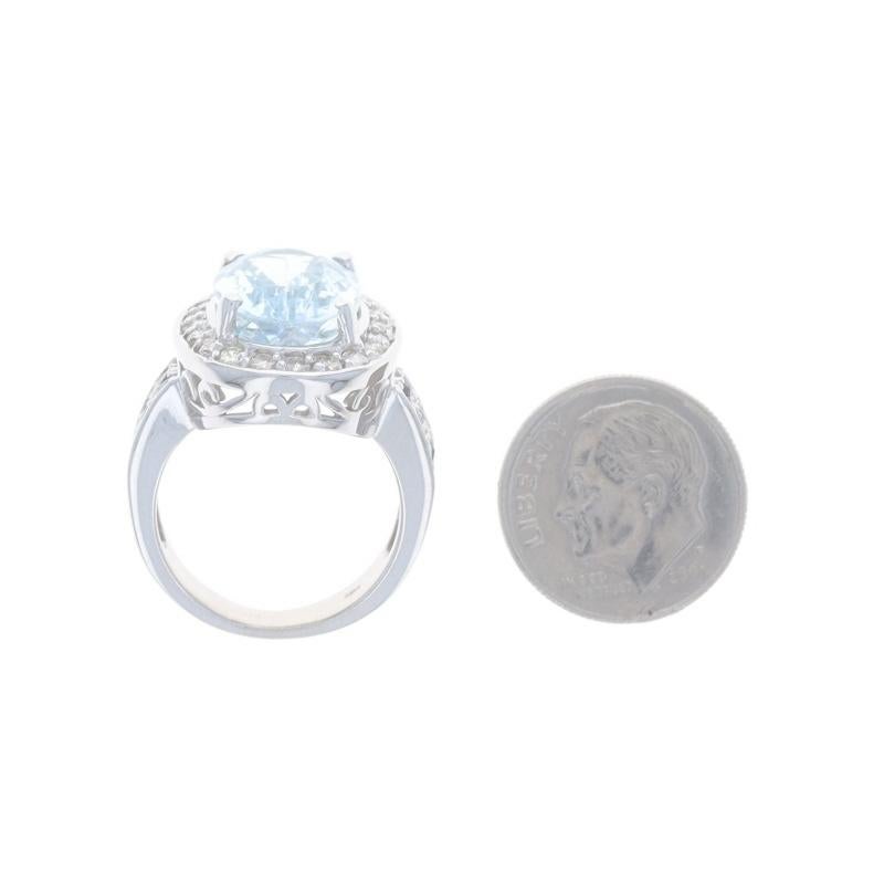 White Gold Blue Topaz, Diamond, & Sapphire Halo Ring - 14k Oval 7.52ctw For Sale 1