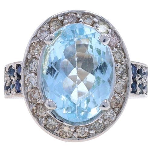 White Gold Blue Topaz, Diamond, & Sapphire Halo Ring - 14k Oval 7.52ctw For Sale