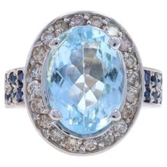 Halo-Ring aus Weißgold mit blauem Topas, Diamant und Saphir - 14k Oval 7,52 ctw