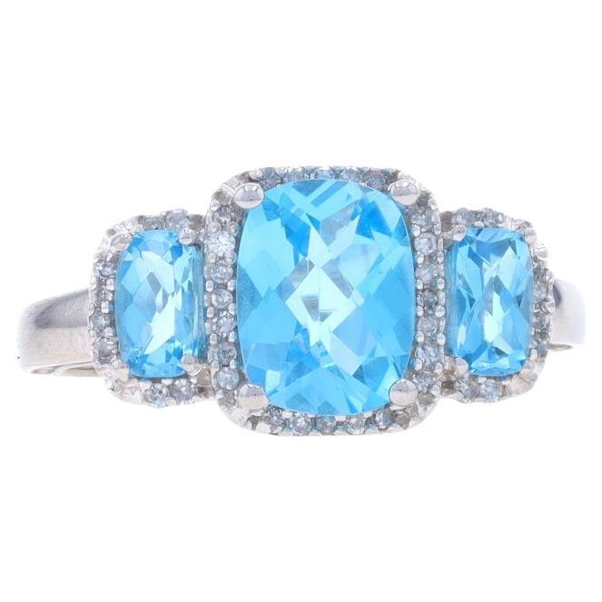 White Gold Blue Topaz & Diamond Three-Stone Halo Ring - 10k Rect Cushion 2.45ctw For Sale