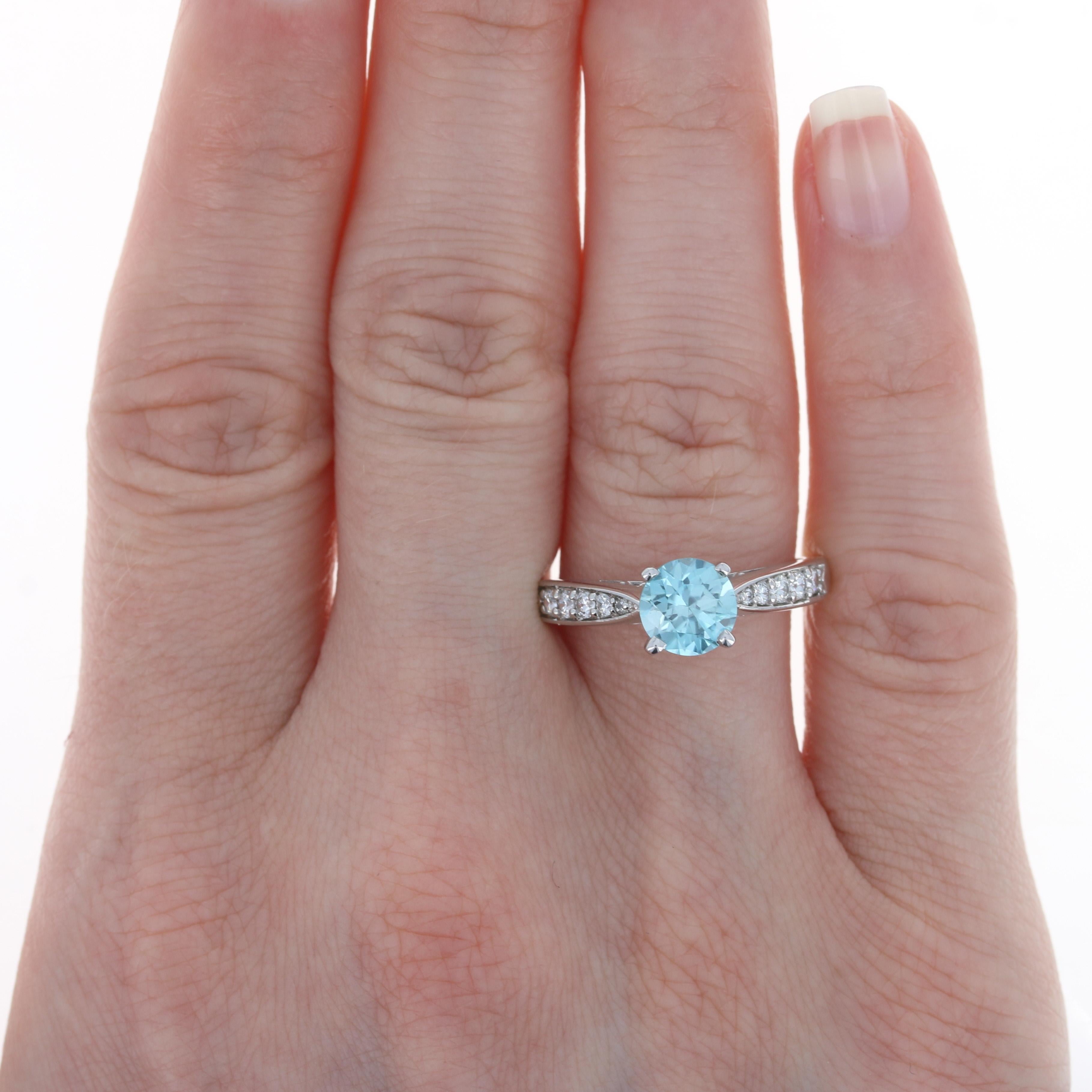 Size: 8 1/2
Sizing Fee: Up 2 sizes for $35 or Down 3 sizes for $30

Metal Content: 14k White Gold

Stone Information: 
Genuine Zircon
Carat: 2.13ct (weighed)
Cut: Round
Color: Blue
Diameter: 7mm 

Natural Diamonds
Carats: .30ctw
Cut: Round