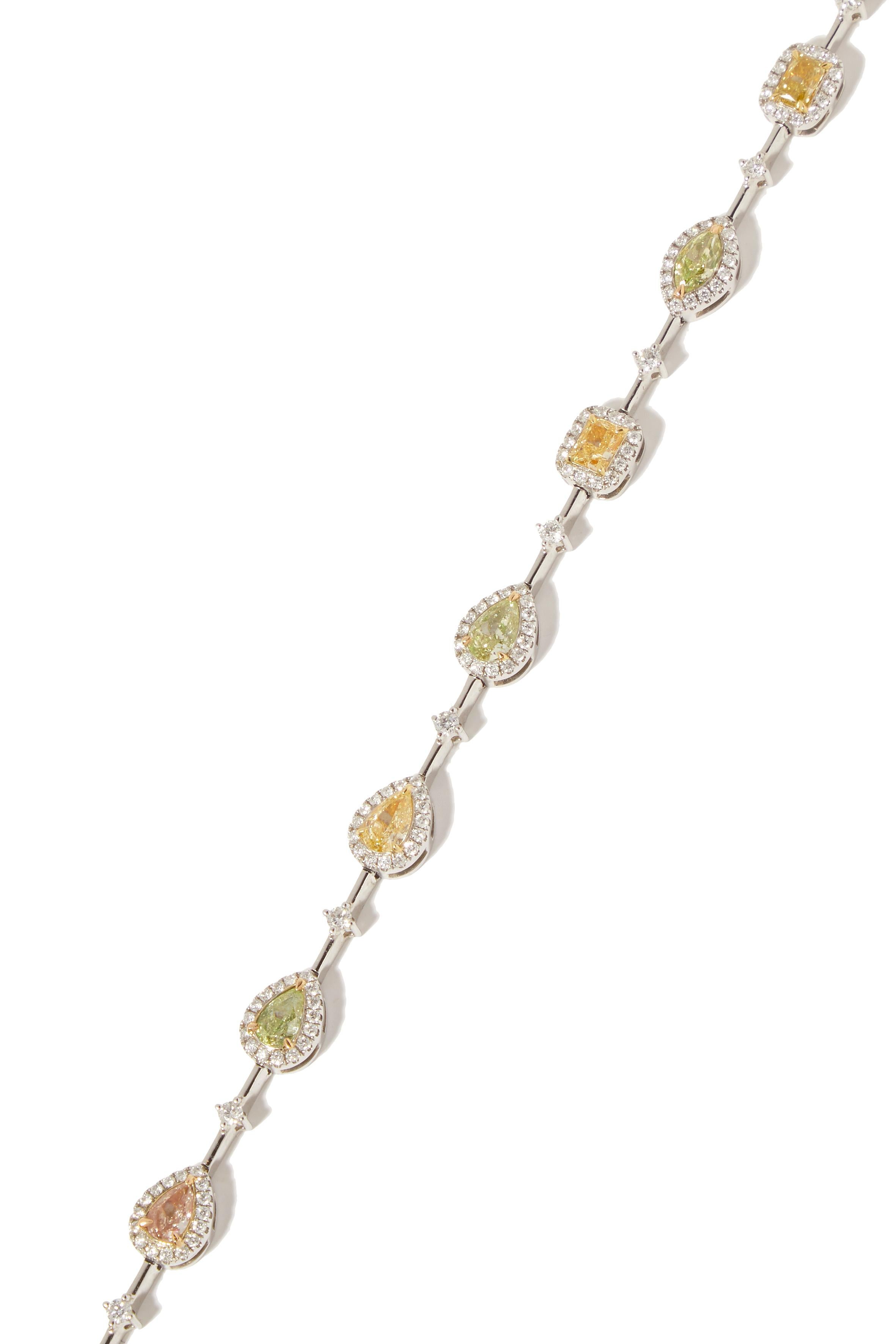 18-karat white gold bracelet with 10 fancy coloured diamonds

An everlasting classic in 18 karat white gold. The gentle hues of yellow, orange, pink, and green diamonds, blended with the brilliance of white diamonds, create a spectacle of color,