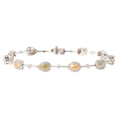 White gold bracelet with 10 fancy coloured diamonds