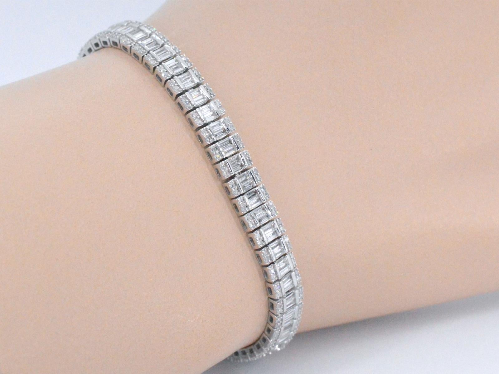 This 14K white gold bracelet is a stunning piece of jewelry that is fully set with diamonds, totaling 4.50 carat in weight. The white gold is a high-quality metal known for its strength and durability, while the diamonds are carefully selected for