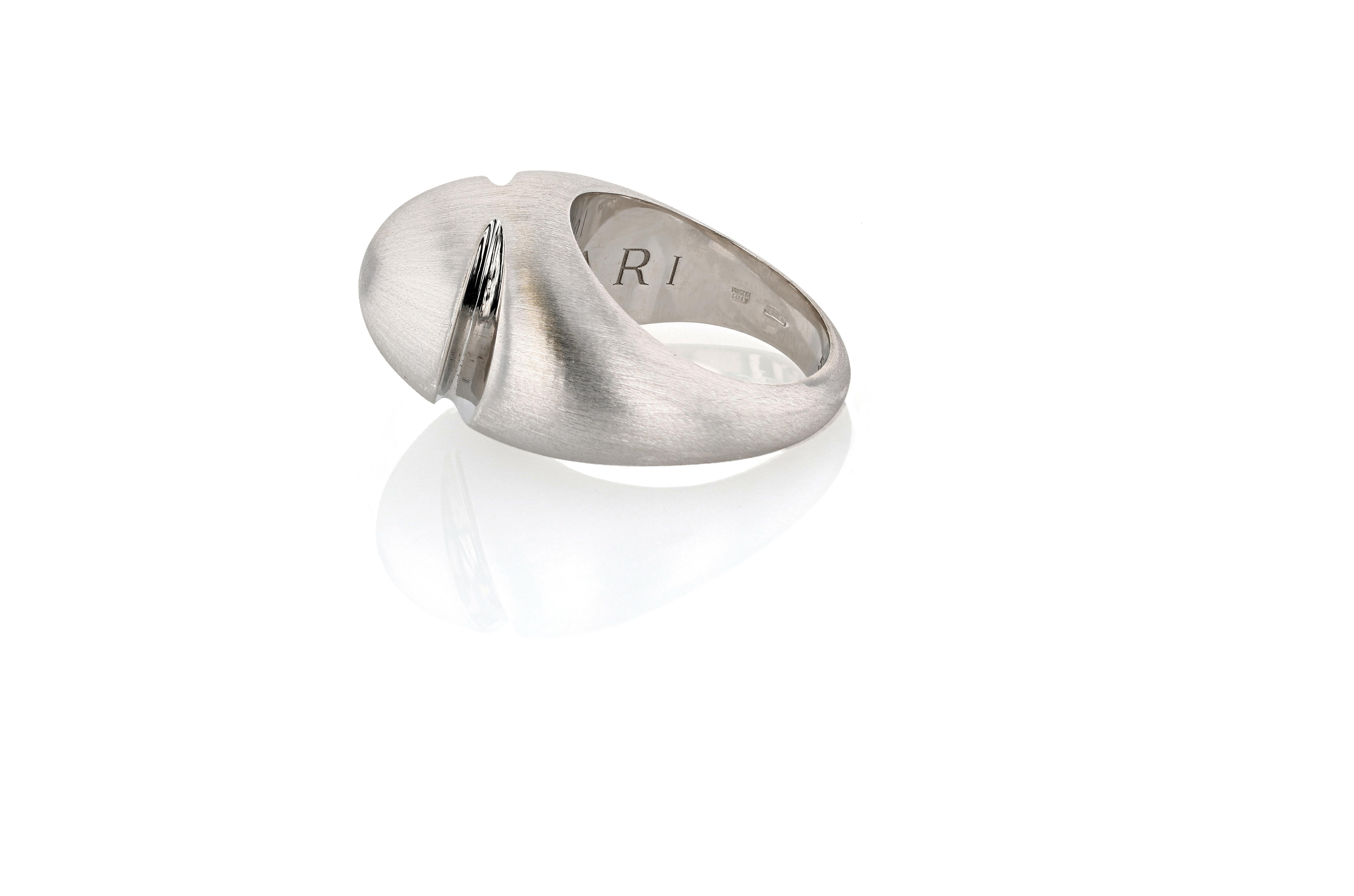 A white gold two-finish vintage Bulgari Cabochon ring.

The ring is finished on its exterior in a sandblasted matte finish, but features one incision at either side whose interior is high polish. The interior of the band is also high polish, with