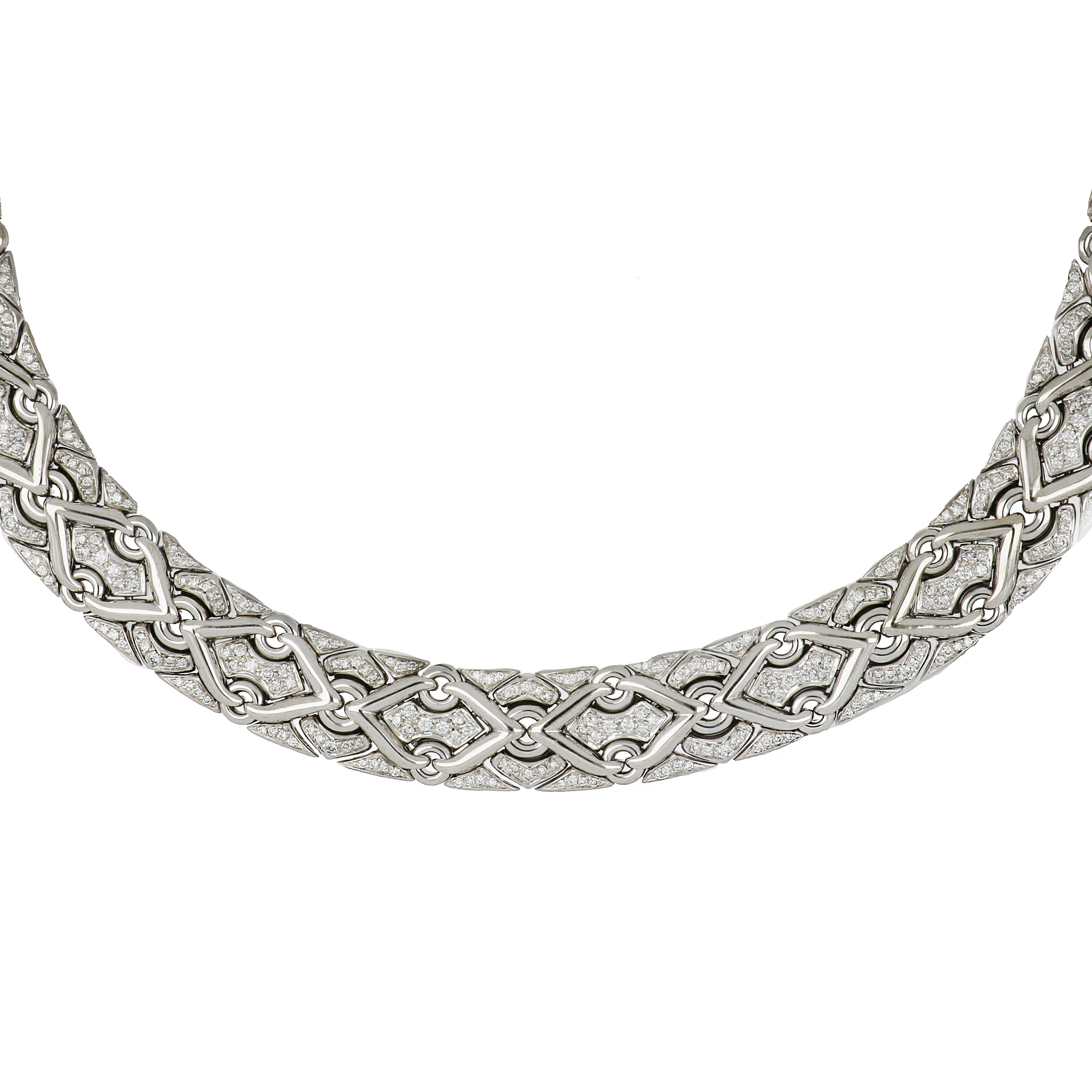 18K white gold diamond necklace by Bulgari.  From the Trika Collection, this interwoven necklace holds 602 round brilliant cut diamonds weighing 8.25 carats; they are E-F in color and VVS in clarity.  Measures 16-1/2