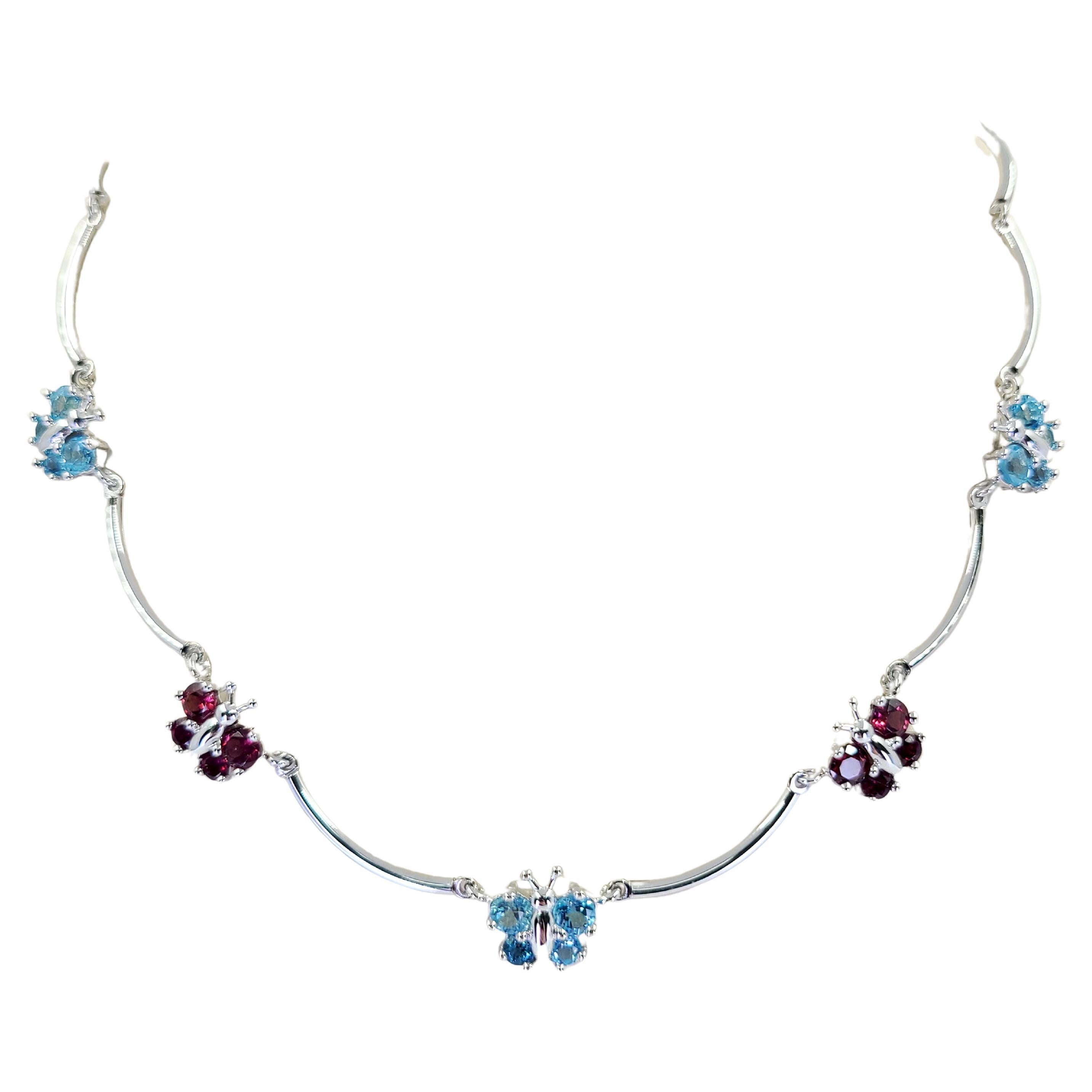 White Gold Butterfly Necklace with Blue Topaz and Garnet