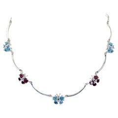 White Gold Butterfly Necklace with Blue Topaz and Garnet