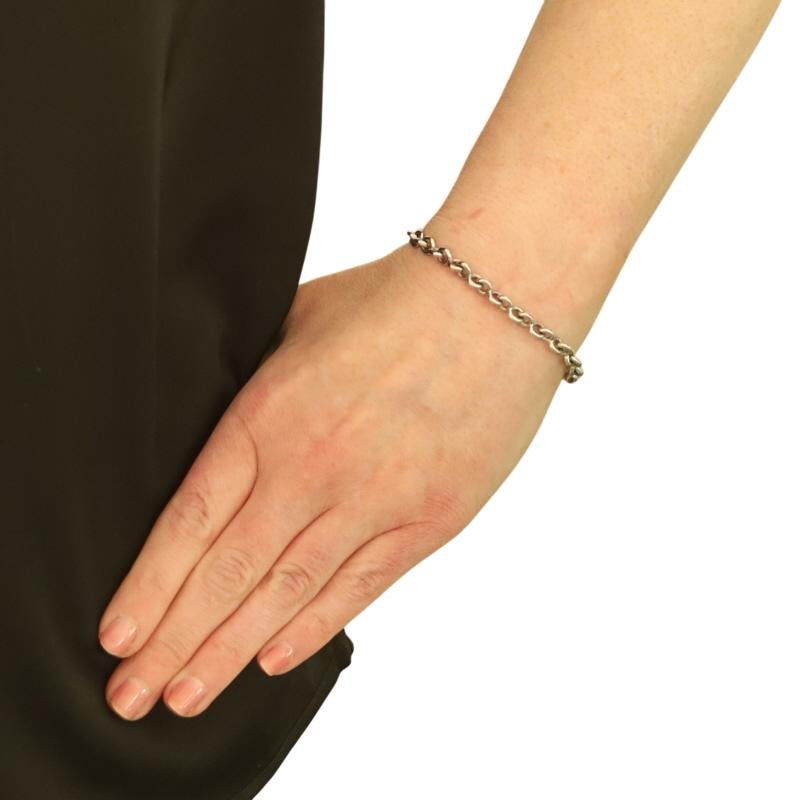 Metal Content: 14k White Gold

Chain Style: Cable-Inspired Link
Bracelet Style: Chain
Fastening Type: Lobster Claw Clasp

Measurements

Chain Width: 1/4
