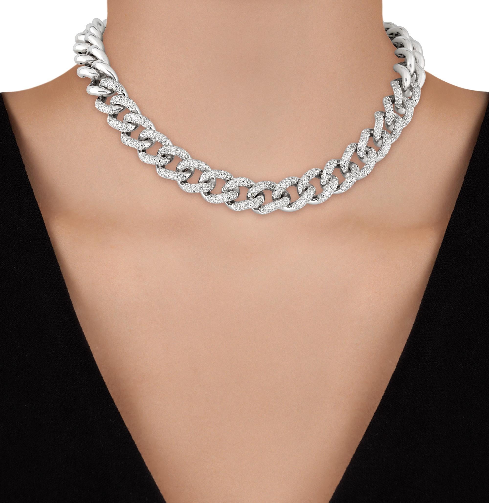 This dazzling necklace features 494 round brilliant cut diamonds of VS1-VS2 clarity and G-H color totaling approximately 3.95 carats. The substantial link chain is encrusted with hundreds of shimmering diamonds, each meticulously pavé set to exude a