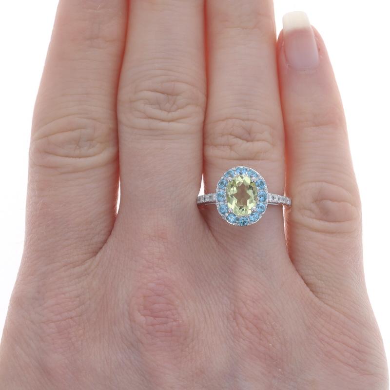 Size: 6
Sizing Fee: Up 2 sizes for $35

Metal Content: 14k White Gold

Stone Information
Natural Citrine
Treatment: Heating
Carat(s): 1.25ct
Cut: Oval
Color: Yellow

Natural Blue Topaz
Treatment: Routinely Enhanced
Carat(s): .48ctw
Cut: