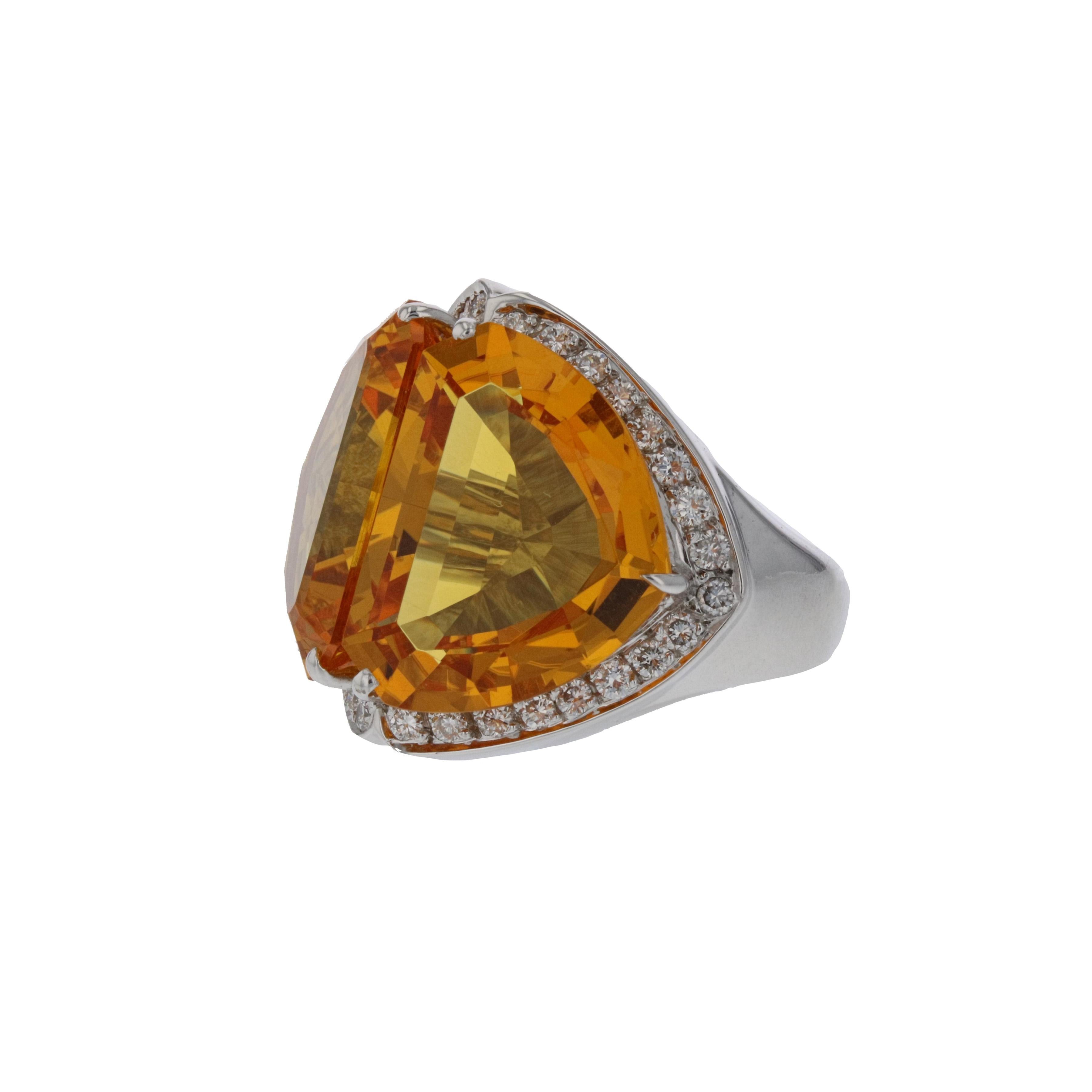 18K white gold ring featuring two large citrine and diamonds.   There are 34 round diamonds that total 0.85 carats; G-H color and VS1-SI1 clarity.  Presentation area measures 1 inch by 7/8 inches.  Size 5 1/2 and may be resized.