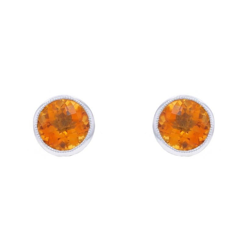 Metal Content: 14k White Gold

Stone Information

Natural Citrines
Treatment: Heating
Carat(s): 1.40ctw
Cut: Round Checkerboard
Color: Orange

Total Carats: 1.40ctw

Style: Stud
Fastening Type: Butterfly Closures
Features: Milgrain
