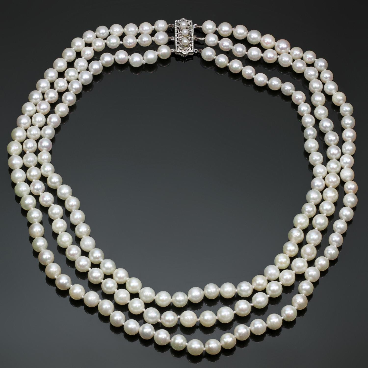 This classic modern necklace features three rows of 6.0mm -7.0mm cultured pearls of medium luster and creamy color. Completed with a 14k white gold clasp. Made in United States circa 2000s. Measurements: 0.27