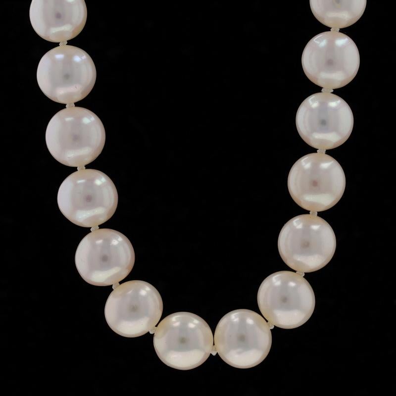 Metal Content: 14k White Gold

Stone Information
Cultured Freshwater Pearls
Color: White
Size: 9.7mm - 10.3mm

Style: Knotted Strand
Fastening Type: Tab Box Clasp with Safety Bar
Features: Ribbed Detailing on Clasp

Measurements
Length: 16