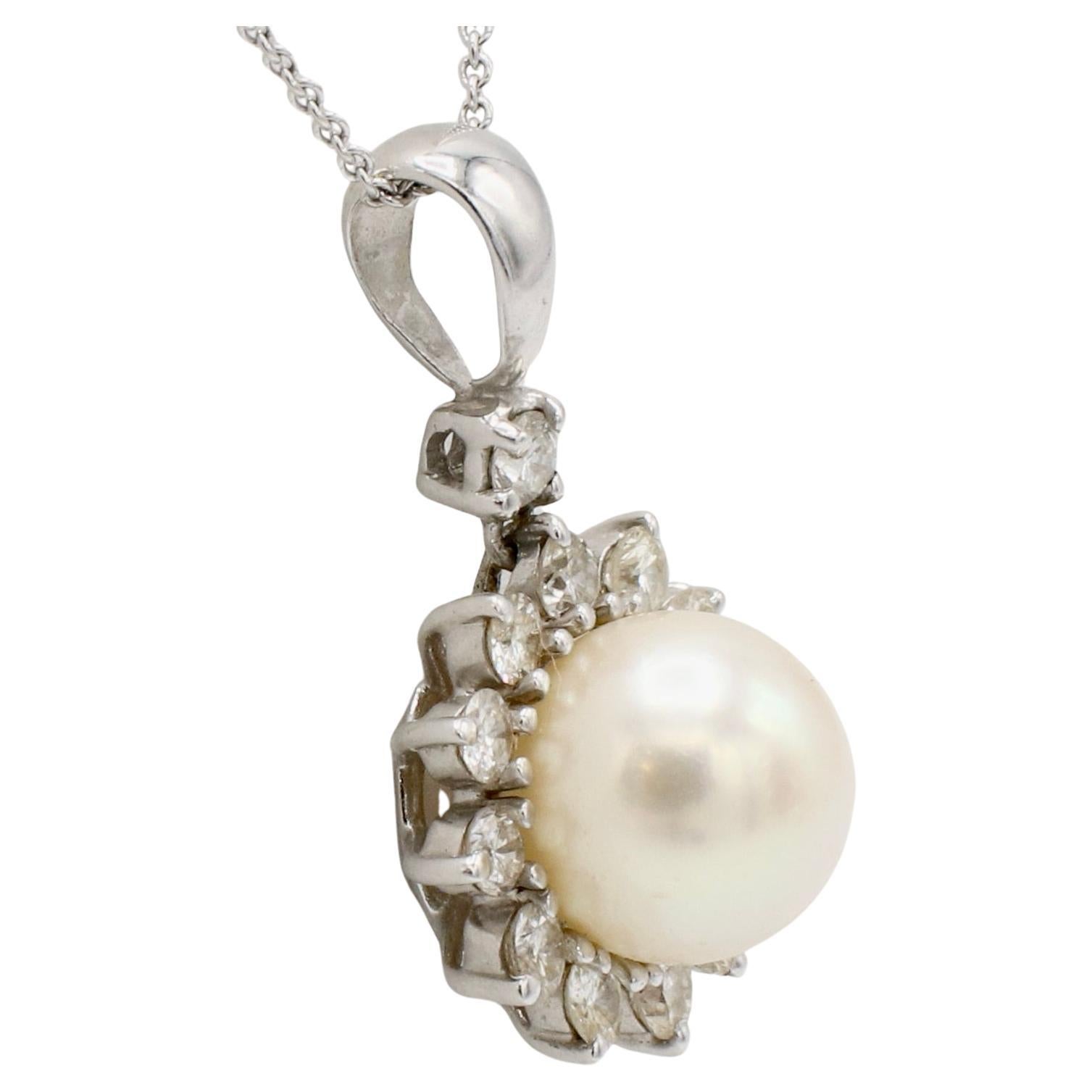 White Gold Cultured Pearl & Natural Diamond Drop Pendant Necklace
Metal: 14k & 18k white gold
Chain: 18k, 18 inches
Pearl: 9mm cultured pearl
Diamonds: Approx. 0.65 CTW G VS round natural diamonds
Drop: 14K, 24mm
Bale opening: 3.5mm
Weight: 5.2